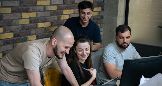 Group of software developers on project management